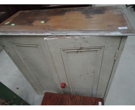 A vintage painted kitchen cabinet