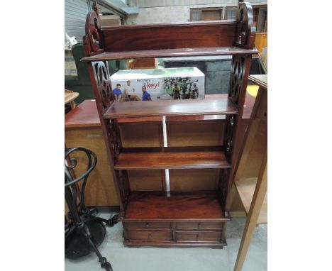 A modern mahogany small shelf unit