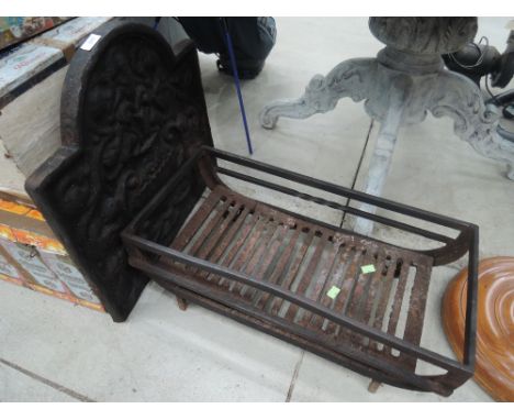A traditional cast dog fire grate
