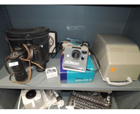 A selection of viewing and photographic equipment including Polaroid camera and Aldis projector