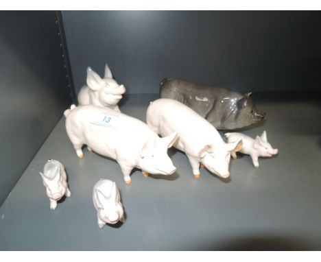 A selection of seven Beswick ceramic pig figures