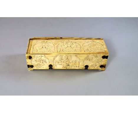 An Indian ivory and white metal mounted casket, 17th/18th century, of rectangular form, top and sides carved with figures, wh