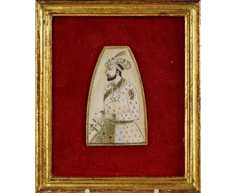 An Indian miniature portrait painting on ivory, 19th Century, probably showing a Maharaja in profile, in red velvet mount and