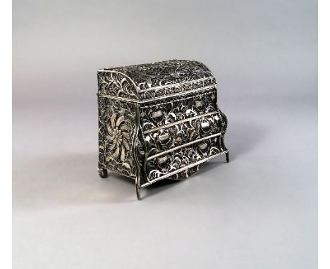 An Anglo-Indian silver miniature bombe commode, late 18th/early 19th century, with hinged domed top above three long drawers,