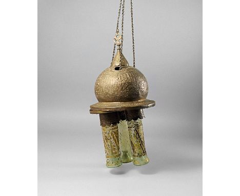 A large Qajar brass and white metal damascened Mosque lamp, 19th century, overall decorated with pierced foliate decoration, 