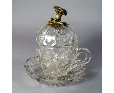 A Turkish Ottoman ormolu mounted cut glass crystal cup and cover with saucer, 19th Century, the domed cover with flowering fo