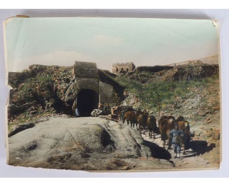 Kang-Sing Chiao (Chinese, 19th Century) a coloured albumen print, circa 1900, a man leading a caravan of camels through a tun