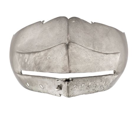 A SOUTH GERMAN VISOR FOR A CLOSE HELMET, MID-16TH CENTURY, with horizontal vision slit above an inward-turned step, reinforce