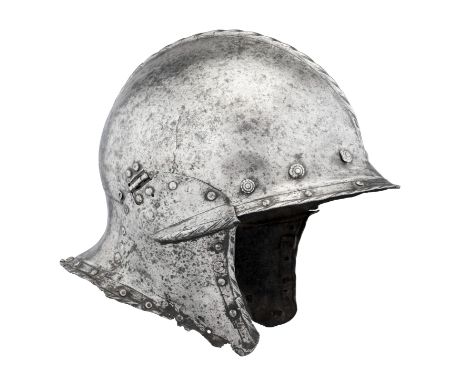 A GERMAN BURGONET, CIRCA 1530, with rounded one-piece skull rising to a low roped medial comb, drawn-out at the front to an o