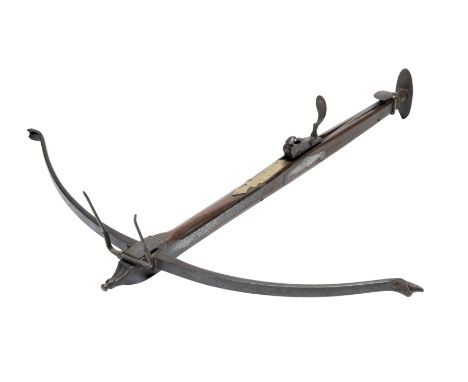 AN ENGLISH STONEBOW, THIRD QUARTER OF THE 18TH CENTURY, with slender steel bow retained by a pair of irons (string missing), 