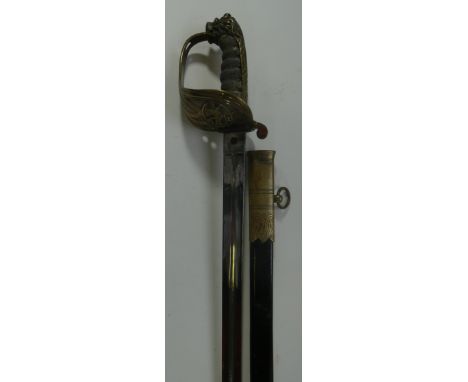 A ROYAL NAVAL RESERVE OFFICER~S SWORD, POST 1902, with polished blade retaining traces of etched decoration, brass hilt with 