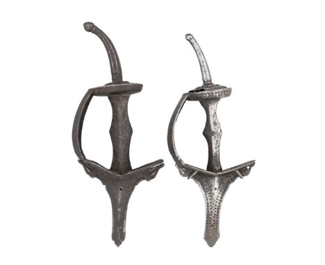 AN INDIAN HILT FOR A DAGGER (KHANJAR), ANOTHER FOR A SWORD (KHANDA); ANOTHER, SIMILAR; ANOTHER FOR A DAGGER (BICHWA) AND THRE