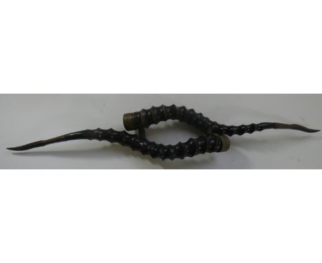 AN INDIAN PARRYING WEAPON (MADU), 19TH CENTURY, INSCRIBED SERGEANT W. HIGGINS, 46TH REGIMENT, formed of a pair of horns joine
