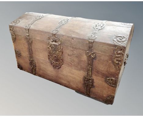 A 19th century Continental iron bound dome topped shipping trunk 