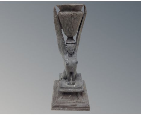 An antique pewter Egyptian style candlestick 