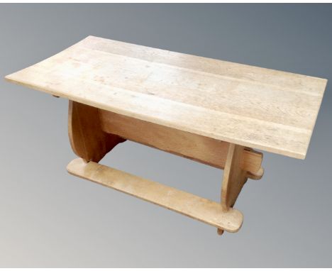 An early 20th century light oak coffee table 