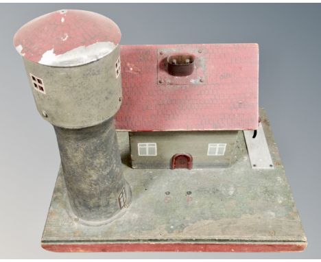 A 20th century vintage electric model of a farmhouse with silo 