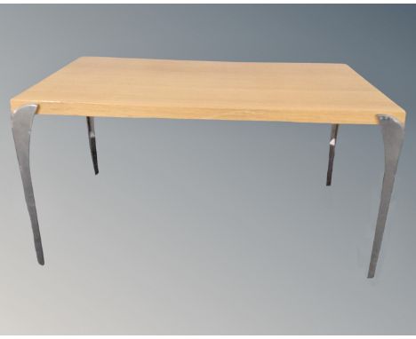 A Scandinavian contemporary light oak dining table