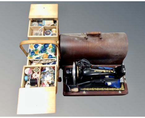 A vintage Singer sewing machine (converted) in case together with sewing box and contents 