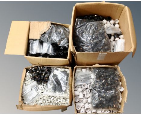 Four boxes of table lamp fittings 