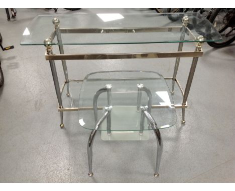 A contemporary glass and metal two tier console table together with similar lamp table 