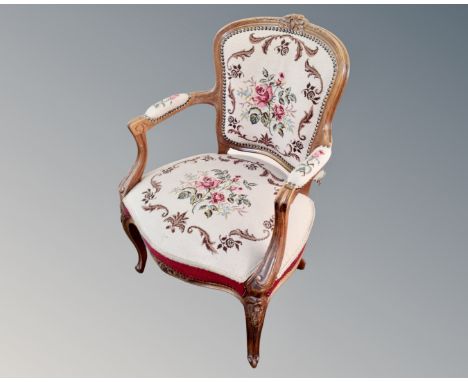A Continental carved beech tapestry upholstered chair 