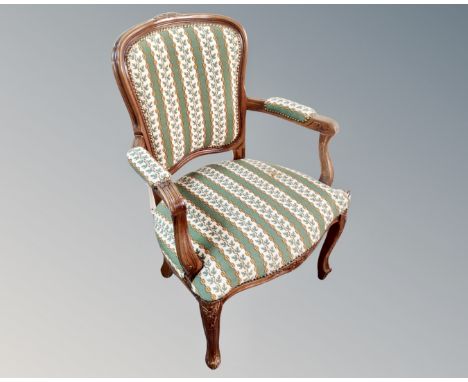 A Continental carved beech tapestry upholstered chair 