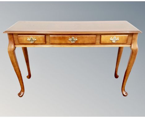 A contemporary three drawer console table on cabriole legs  CONDITION REPORT: measurements : height 77 cm x width 122 cm x de