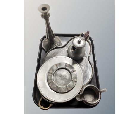 A tray of antique pewter to include hammered candlestick, plates etc 