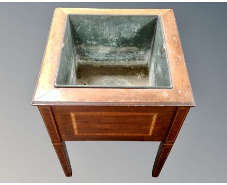 An Edwardian inlaid mahogany planter with metal liner 