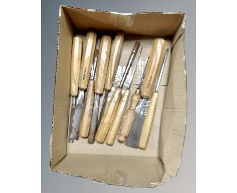 A box of ten vintage Swiss made wood working chisels 