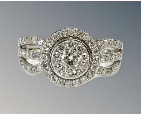 A 9ct white gold diamond set cluster ring, size N. CONDITION REPORT: 3g