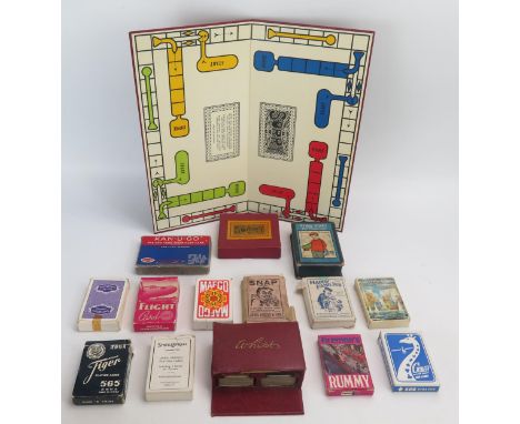 A collection of children's card games, assorted playing cards and board game "go". 