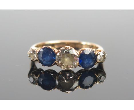 An Antique 18ct Gold, Sapphire and Diamond Five Stone Ring, 5.45mm principal old cut with 2.15mm stones to the shoulders and 