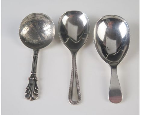 A George IV silver caddy spoon, maker George Unite, Birmingham, 1836, together with two modern  caddy spoons, total weight of
