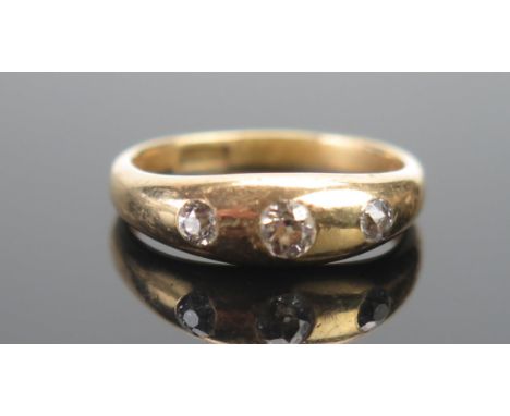 An Antique 18ct Gold and Old Cut Diamond Three Stone Ring, c. 3.7mm principal stone, size O.5, stamped 18CT, 5.18g 