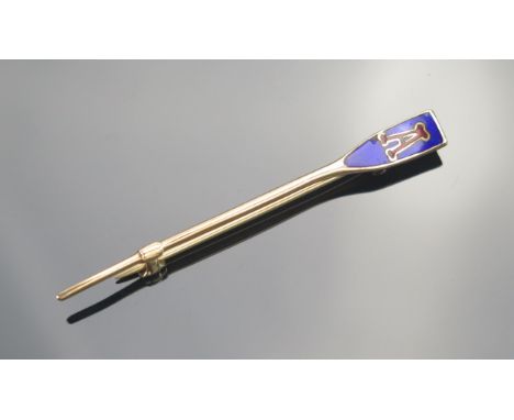 A Gold and Enamel Oar Brooch decorated with a capital "A", marked SOLID GOLD, KEE tests as 10ct, 2.46g.  UNLESS OTHERWISE STA