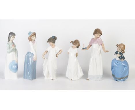 A collection of six Nao porcelain figurines of young girls, various sizes. (6). 