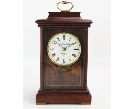 Knight &amp; Gibbons, a mahogany mantel clock, of rectangular outline with 8cm Roman dial, with German circular movement stri