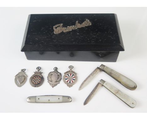 Two silver bladed and mother-of-pearl handled folding fruit knives, a steel bladed example four silver fobs contained in an e