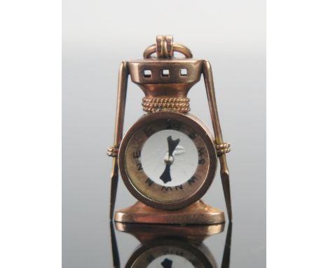 An Antique 10K Gold Compass Fob in the form of a capstan, stamped with RD no., 10 and a cross in a shield, 4.46g 