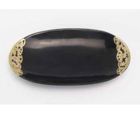 A horn and gilt metal mounted ring tray, of oval outline, 18.5cm wide. 