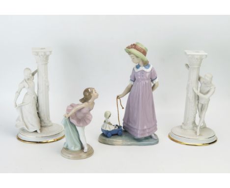 A pair of Franklin Mint bisque porcelain candlesticks modelled as Romeo and Juliet, 25cm high, together with a Lladro figure 