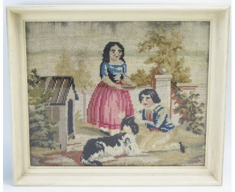 A 19th century gros point wool work  of a boy and girl playing with a dog, 25.5cm x 31cm F &amp; G. 