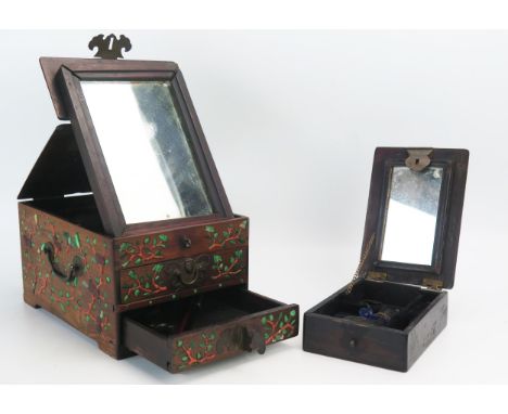 A Chinese wood and hardstone inlaid dressing box, The hinged lid with mirror plate containing three short drawers, 23.5cm wid