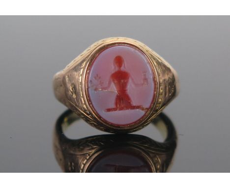 An Antique Precious Yellow Metal Sheathed Hardstone Cameo Ring decorated with a lady holding a castellated tower and an olive
