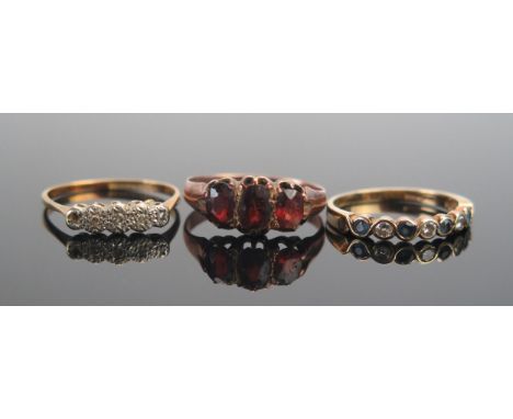 An 18ct Gold and Diamond Ring (size O.5, 1.88g. A/F), an antique 9ct gold and garnet three stone ring (size Q, 1.91g) and a 9