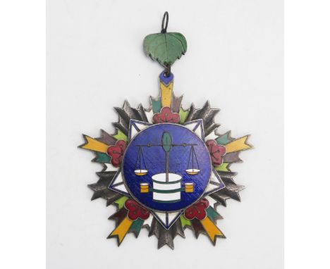 A large Chinese enamel and white metal medallion from Hon Wen Chang province with scales inscribed in Chinese characters to t