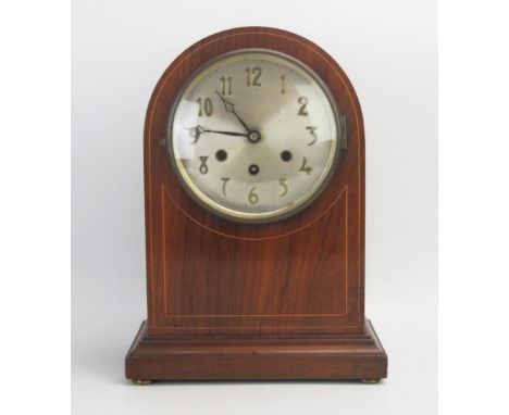 A mahogany and boxwood strung mantel clock, of arched outline, with 16cm silvered Arabic dial, the movement striking  to gong