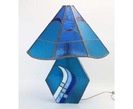A leaded glass table lamp in the Mackintosh style with octagonal multi-coloured shade, on a lozenge shaped base, 57cm high. 
